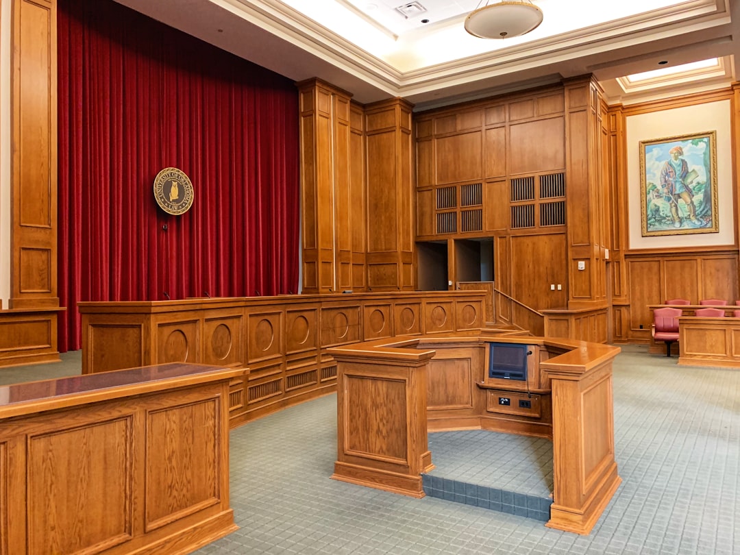 image of an empty, formal hearing room or courtroom - Difficult immigration cases image of an empty, formal hearing room or courtroom - Difficult immigration cases
