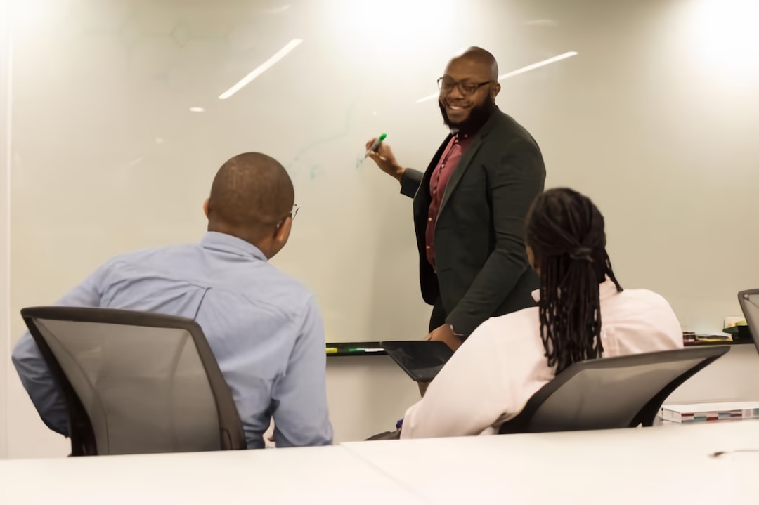 A manager leading a team meeting - L-1 visa attorney A manager leading a team meeting - L-1 visa attorney
