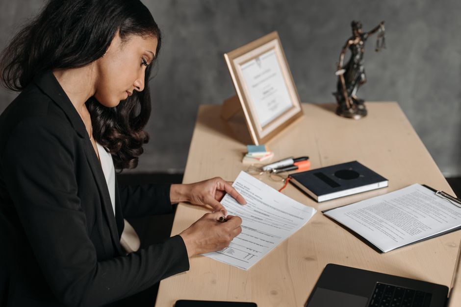 Person reviewing legal documents - pr family sponsorship