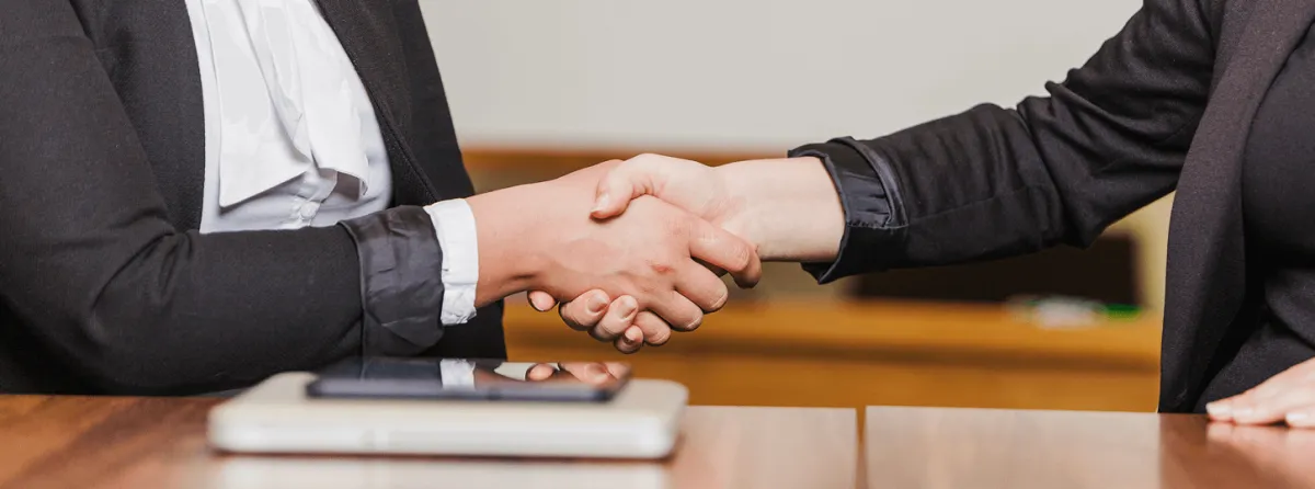Attorney and client shaking hands